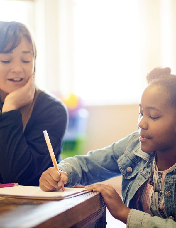Professional working with child in school