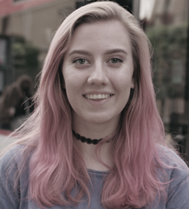 Headshot of teen with pink hair